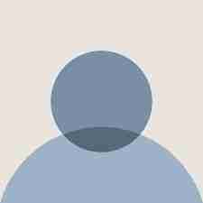 Simple blue graphic of a person's head and shoulders.